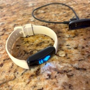 Excellent used condition. Includes charger and extra strap.